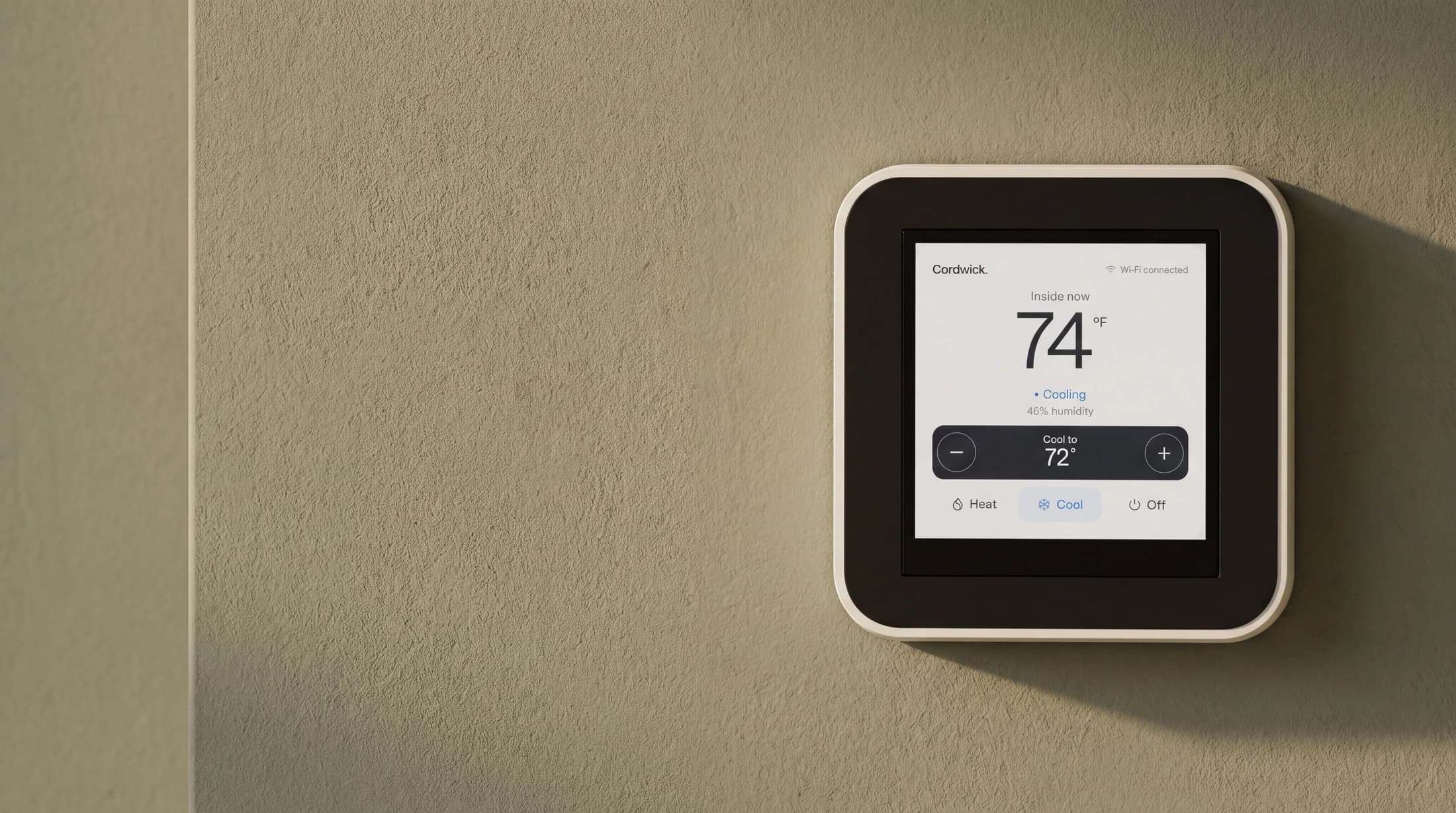 Cordwick Ease smart thermostat design with a porcelain surround and clear screen, illustrated on an olive wall